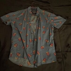 Blue short sleeved button up with popcorn print.